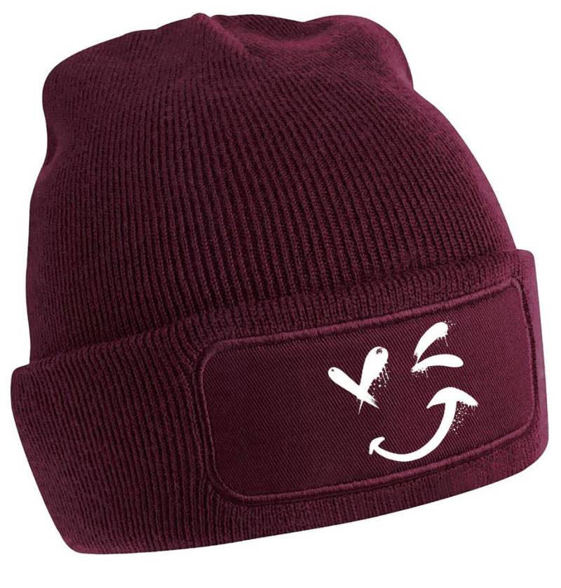MyDesign24 Strickmütze für kalte Tage - Beanie mit zwinkerndem Gesicht Print Coole Street-Art Mütze Wintermütze i328 von MyDesign24