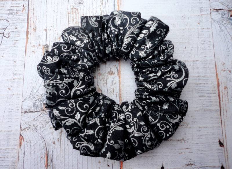 Silver Holly Print On A Dark Grey Background Christmas Scrunchie von MyMissModa
