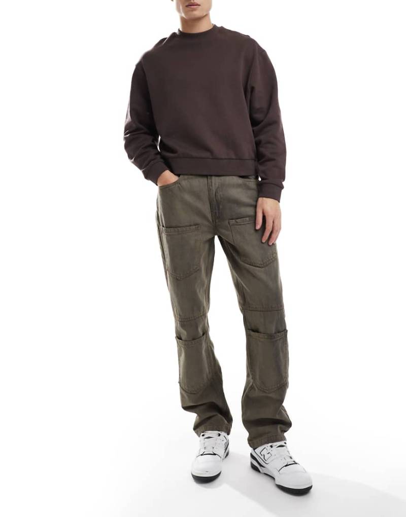 Native Youth - Jeans in brauner Acid-Waschung mit lockerem, geradem Schnitt und aufgesetzten Taschen von Native Youth