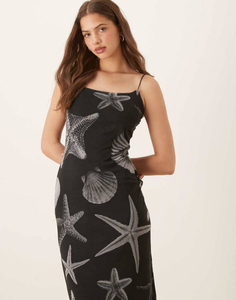 Never Fully Dressed - Trägerkleid aus Netzstoff in Schwarz mit Muschelprint von Never Fully Dressed