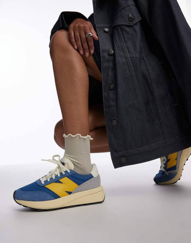 New Balance - 370 - Sneaker in Blau und Gelb von New Balance