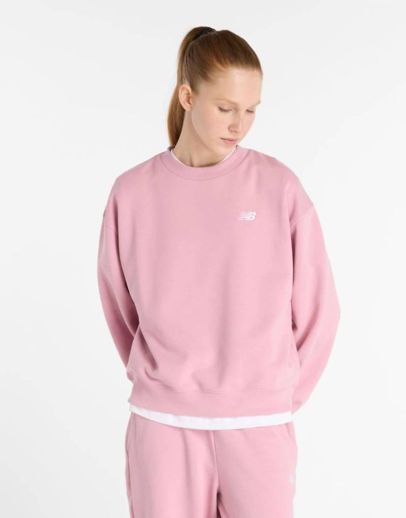 New Balance - Sport Essentials - Sweatshirt aus Frottee in Pink Taffy mit Rundhalsausschnitt-Rosa von New Balance