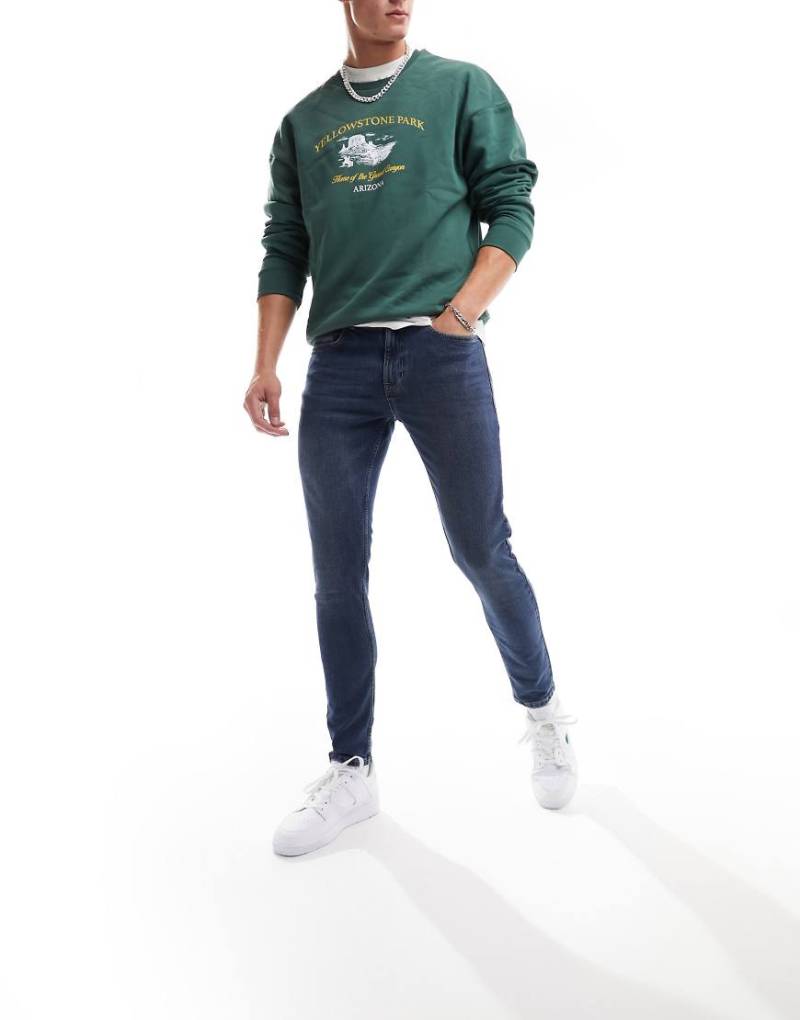 New Look - Enge Jeans in mittelblauer Waschung von New Look