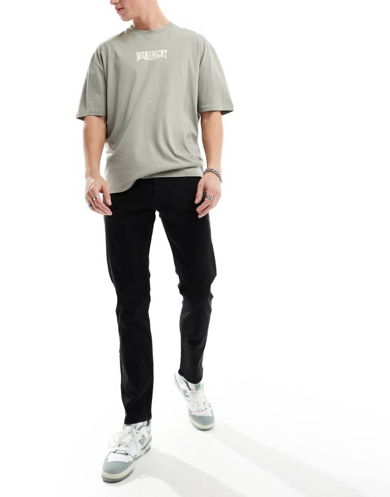 New Look - Schmal geschnittene Jeans in verwaschenem Schwarz von New Look