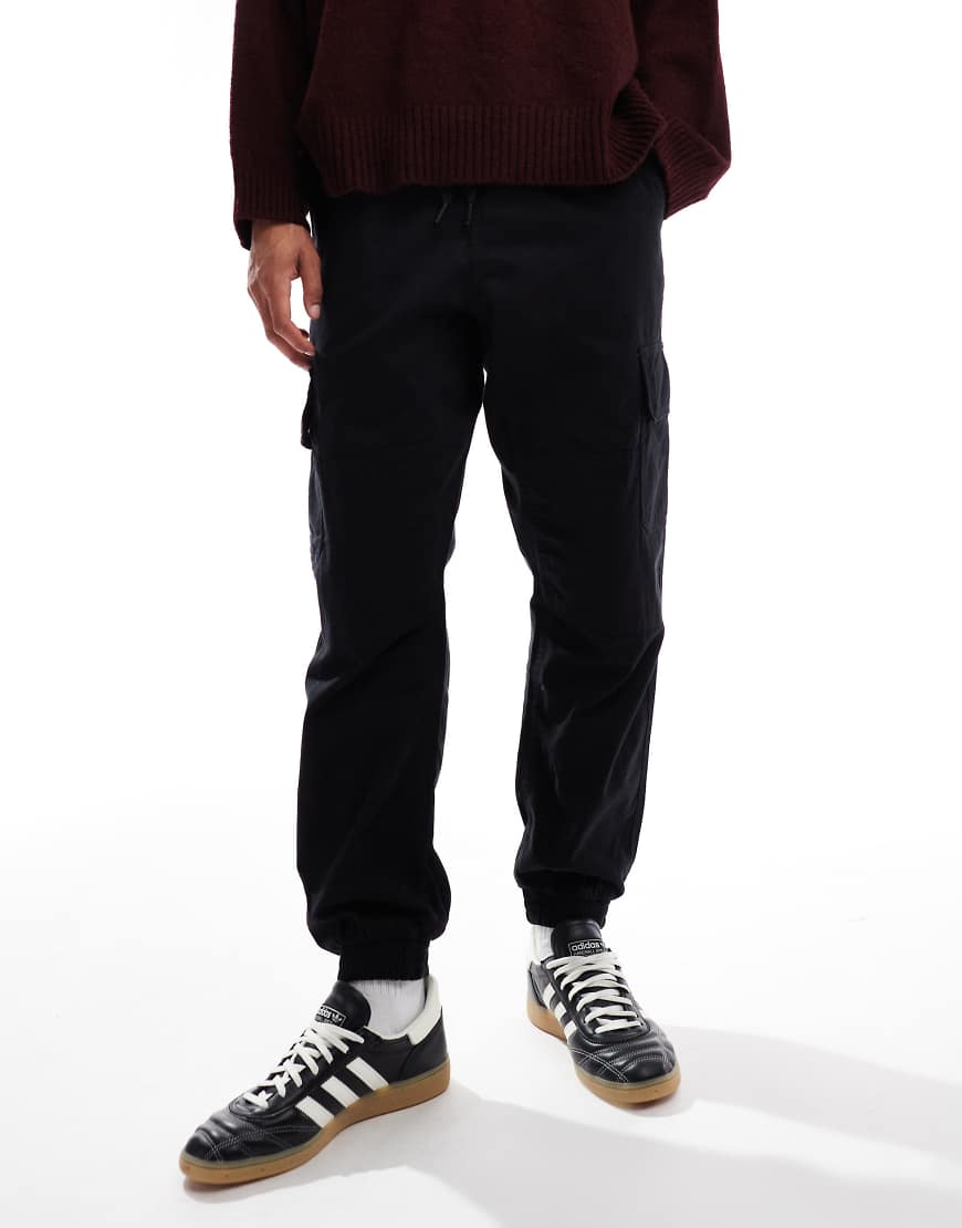 New Look - Slim Fit Cargohose in Schwarz mit Bündchen New Look - Slim Fit Cargohose in Schwarz mit Bündchen von New Look