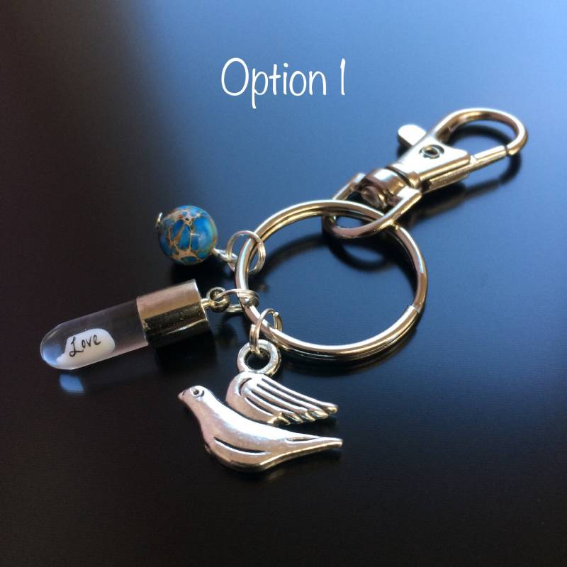 Reis Schriftzug in Einem Charm Schlüsselanhänger/Taschenanhänger Reis Schriftzug in Einem Charm Schlüsselanhänger/Taschenanhänger von NewWorldCreations