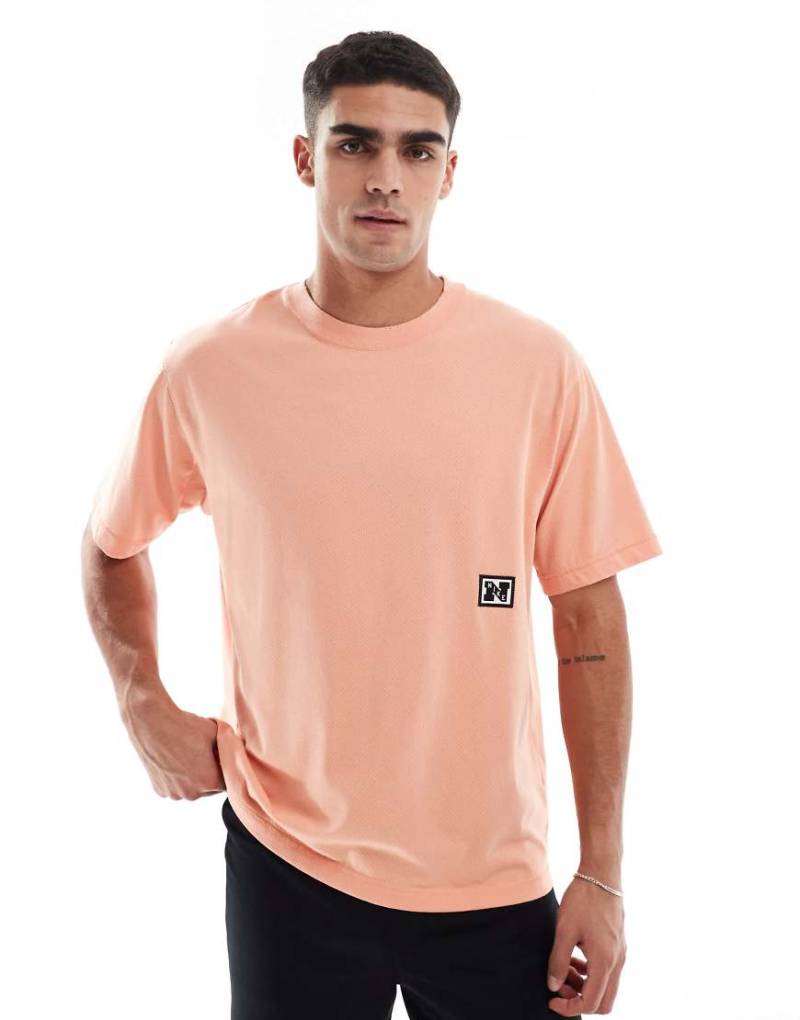 Nike Training - Heritage Dri-FIT - Lauf-T-Shirt in Orange-Rosa von Nike Training