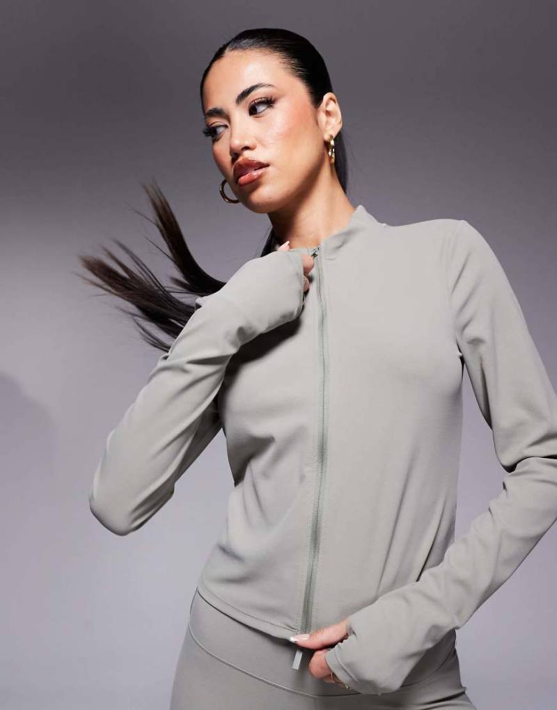 Nike Training - Zenvy - Langärmliges Shirt in Hellgrün mit durchgehendem Reißverschluss von Nike Training