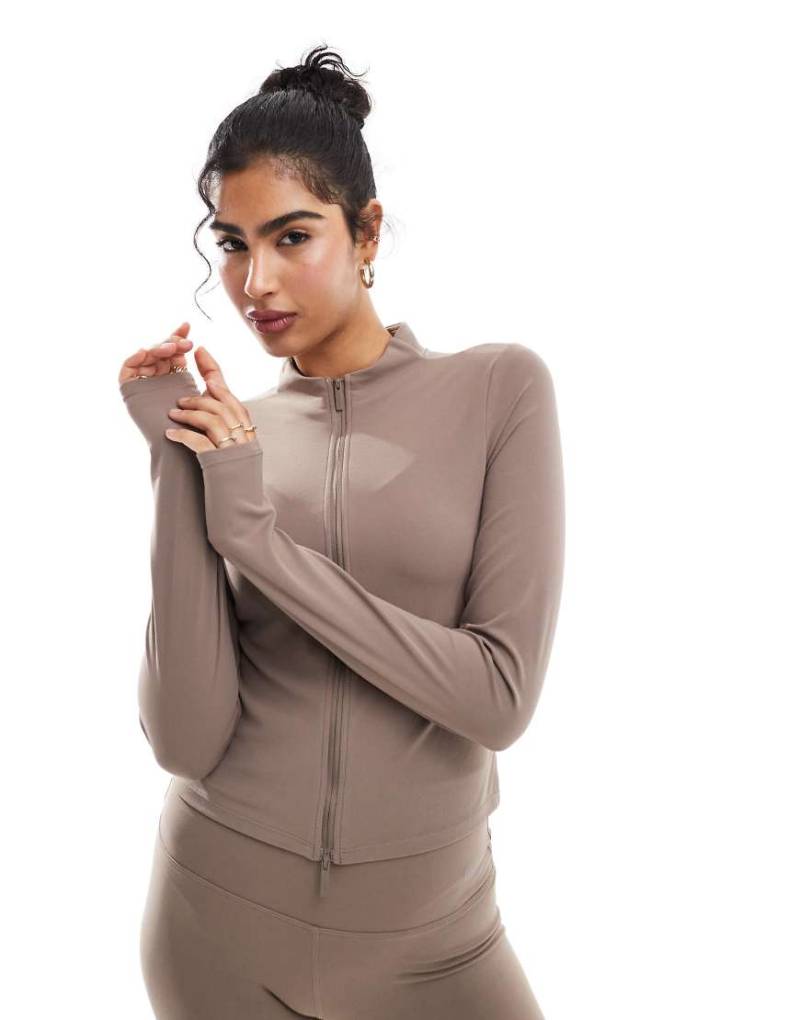 Nike Training - Zenvy Dri-FIT - Weiches, langärmliges Oberteil in Braun mit durchgehendem Reißverschluss von Nike Training