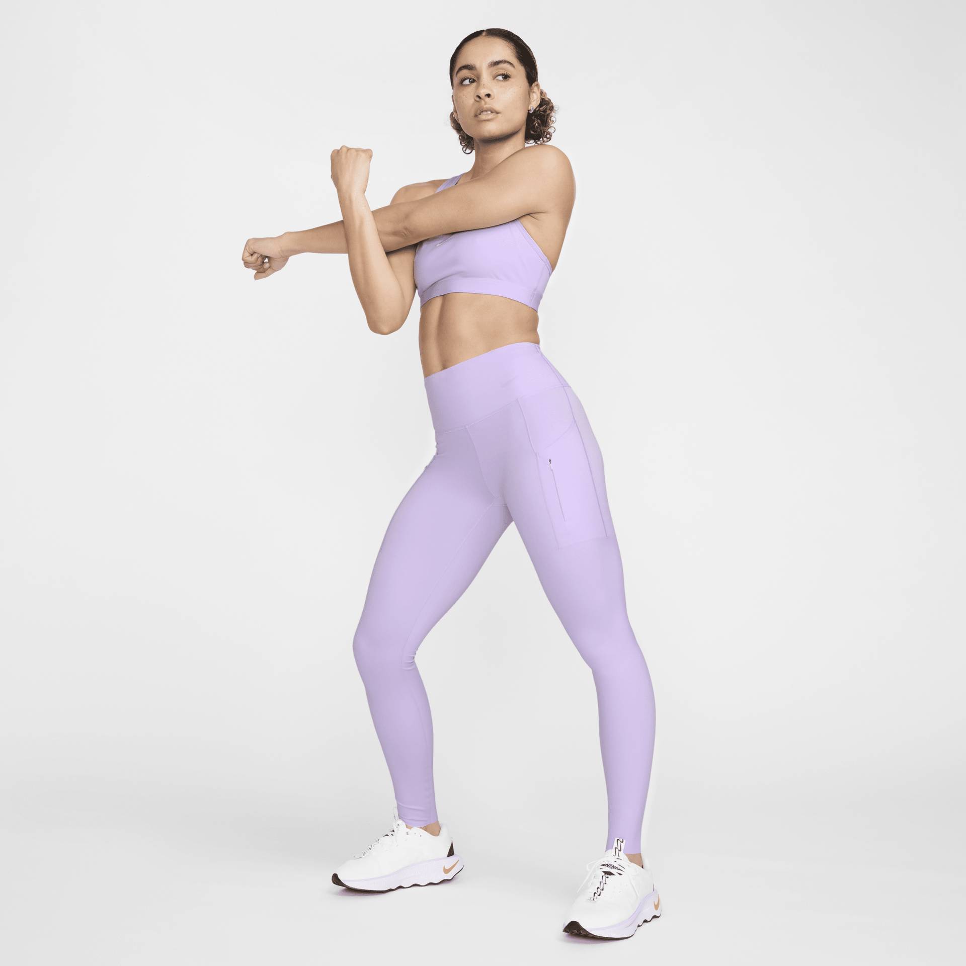 Nike Go Leggings in voller Länge mit starkem Halt, mittelhohem Bund und Taschen für Damen - Lila von Nike