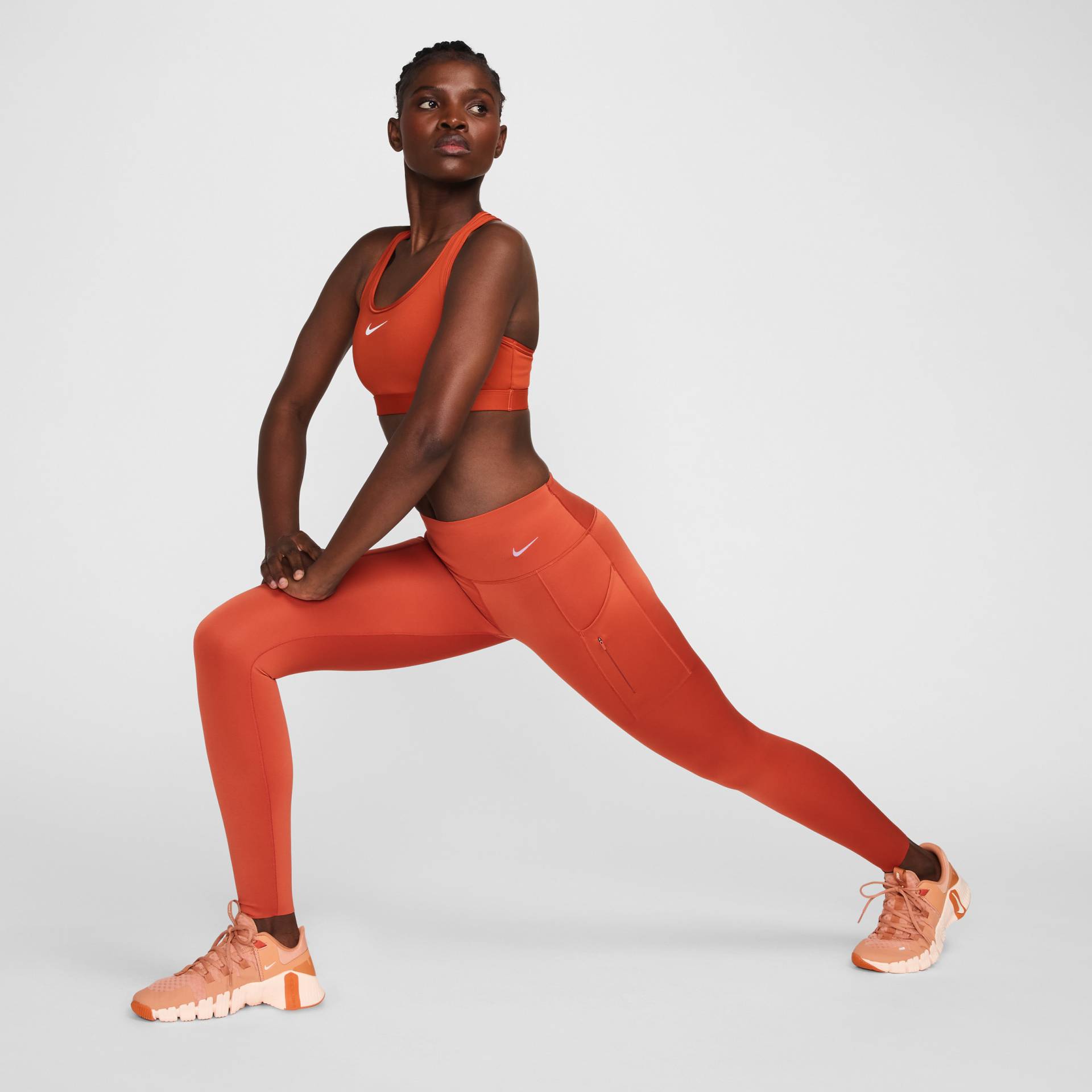 Nike Go Leggings in voller Länge mit starkem Halt, mittelhohem Bund und Taschen für Damen - Orange von Nike