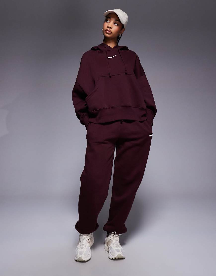 Nike - Phoenix Fleece - Oversize-Jogginghose in Burgunderrot mit hohem Bund und Bündchen von Nike