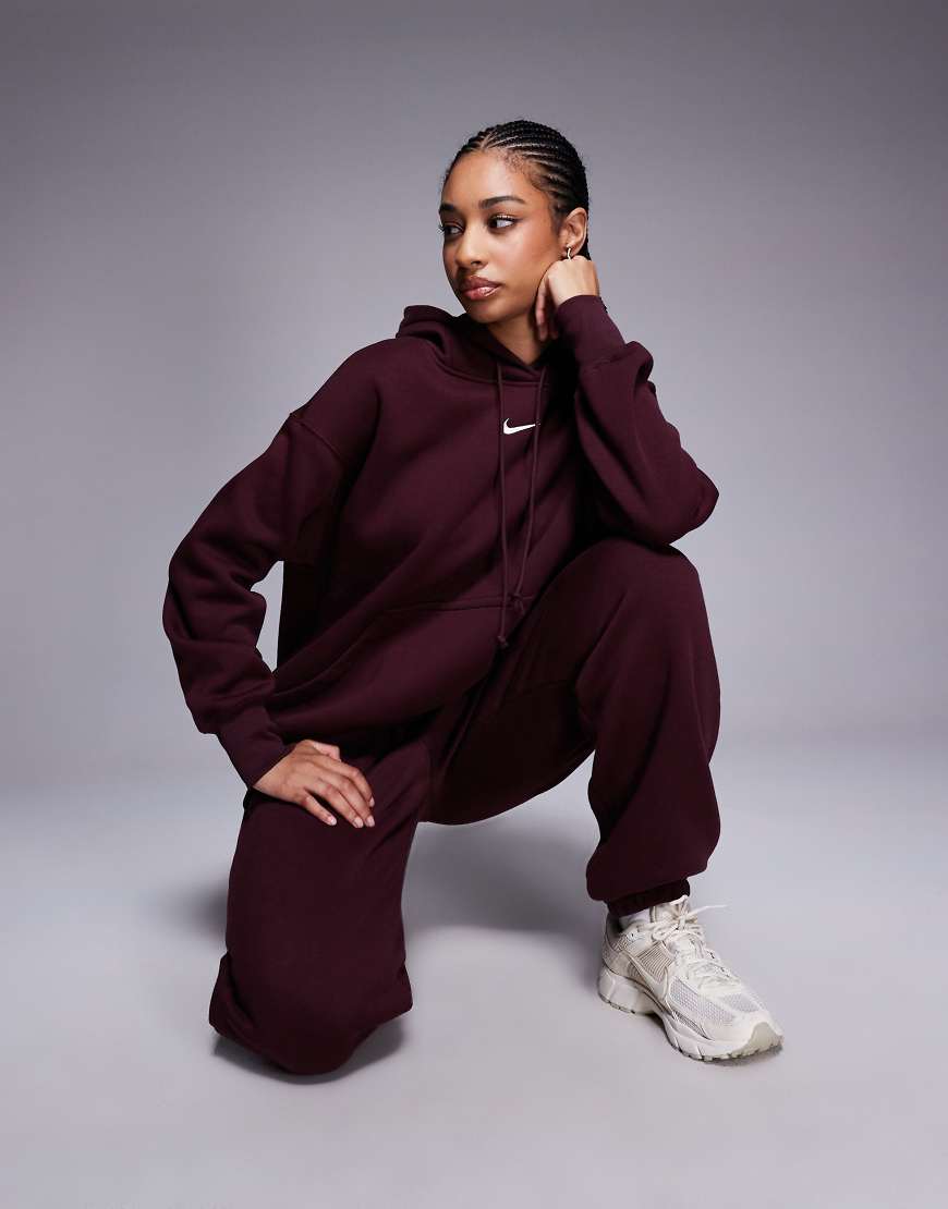 Nike - Phoenix Fleece - Oversize-Kapuzenpullover in Burgunderrot Nike - Phoenix Fleece - Oversize-Kapuzenpullover in Burgunderrot von Nike