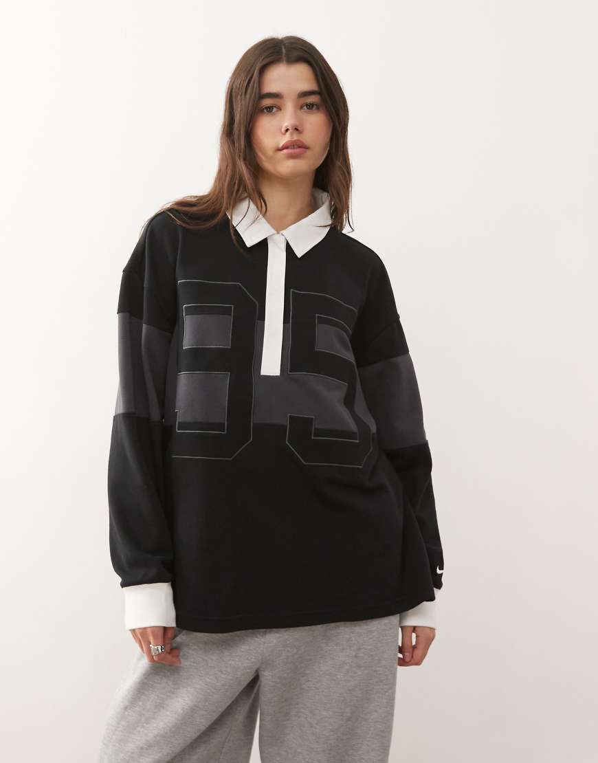 Nike - Street - Langärmliges Polohemd in Grau und Schwarz mit Grafik von Nike