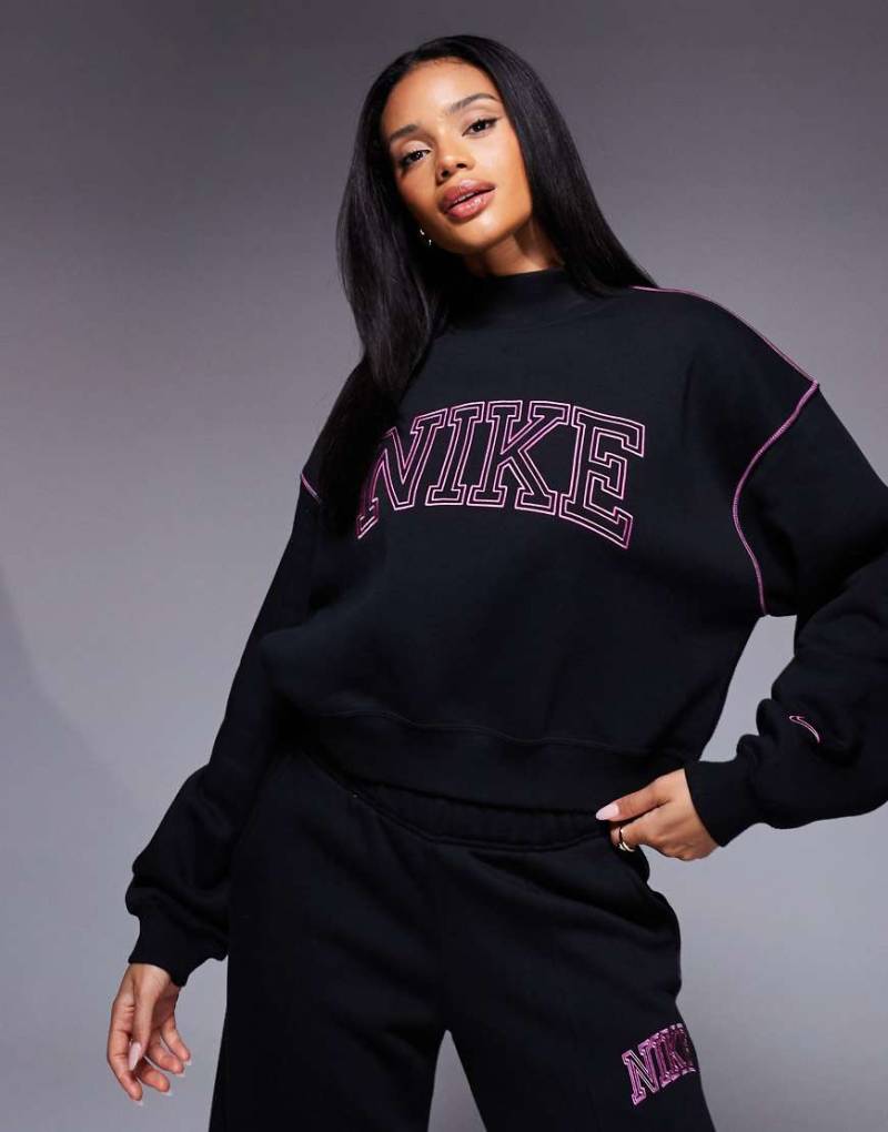 Nike - Sweatshirt in Schwarz und Rosa mit Retro-Logo und Stehkragen von Nike