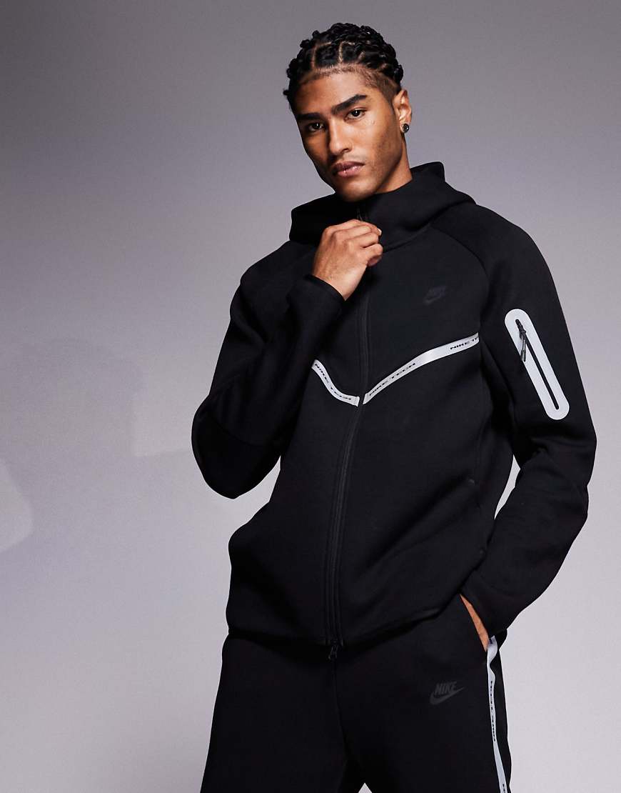 Nike - Tech Fleece - Kapuzenjacke in Schwarz mit reflektierenden Details und Reißverschluss von Nike