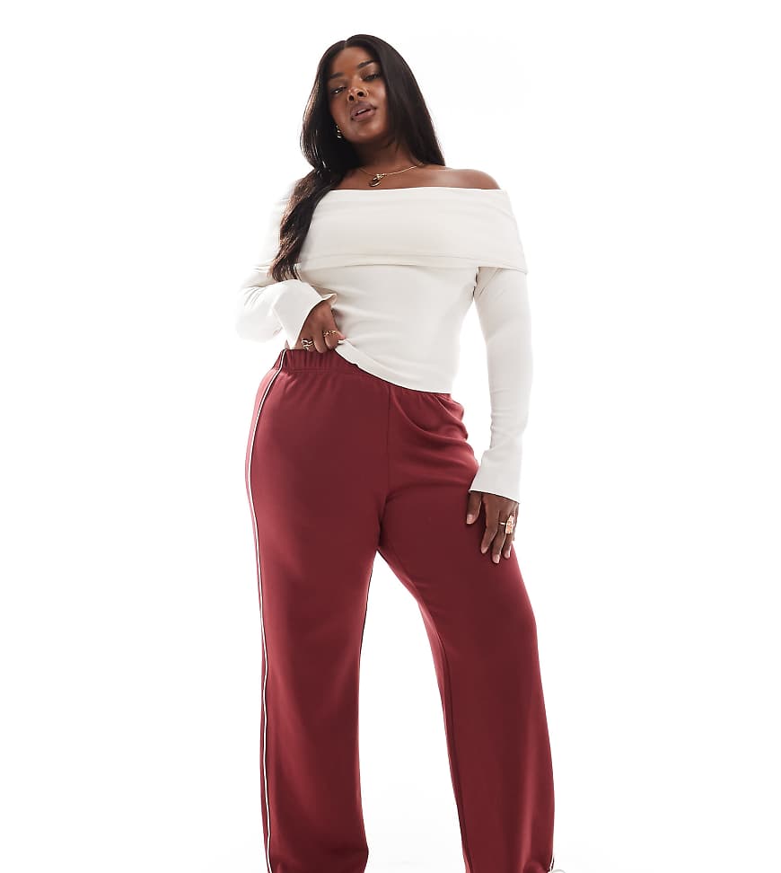 ONLY Curve - Hose in Dunkelrot mit kontrastierender Paspelierung und weitem Schnitt ONLY Curve - Hose in Dunkelrot mit kontrastierender Paspelierung und weitem Schnitt von ONLY Curve