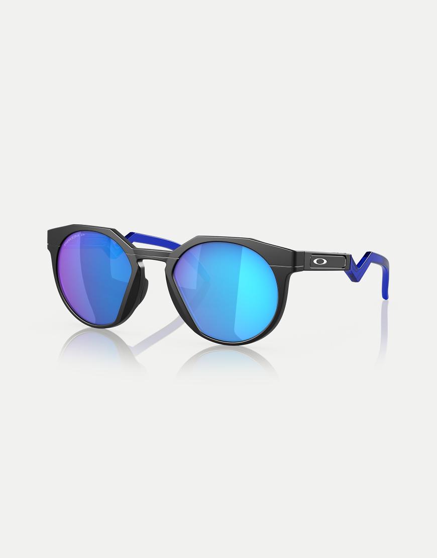 Oakley - Hstn - Runde polarisierte Sonnenbrille in Mattschwarz mit blau verspiegelten Gläsern Oakley - Hstn - Runde polarisierte Sonnenbrille in Mattschwarz mit blau verspiegelten Gläsern von Oakley