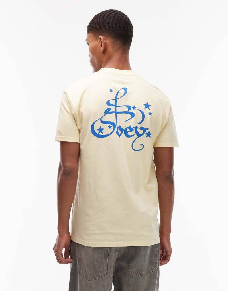 Obey - T-Shirt in Blassgelb mit Mond- und Sternprint von Obey
