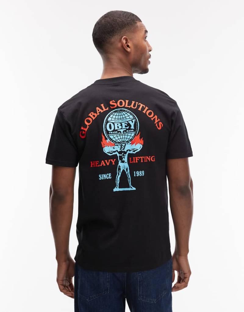 Obey - T-Shirt in Schwarz mit „Heavy Lifting"-Print von Obey