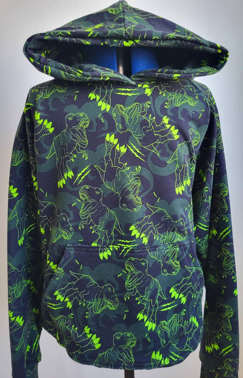 Handgefertigt, Kapuzensweatshirt Aus Baumwolle, Mit Grünem Dinosauriermuster Und Kanguru-Tasche, Oliviafloradesign Handgefertigt, Kapuzensweatshirt Aus Baumwolle, Mit Grünem Dinosauriermuster Und Kanguru-Tasche, Oliviafloradesign von OliviaFloraDesign