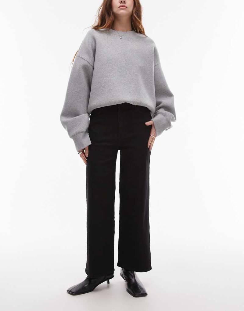 & Other Stories - Elastische, kurz geschnittene Jeans mit Rinse-Waschung in Schwarz und weitem Bein von Other Stories