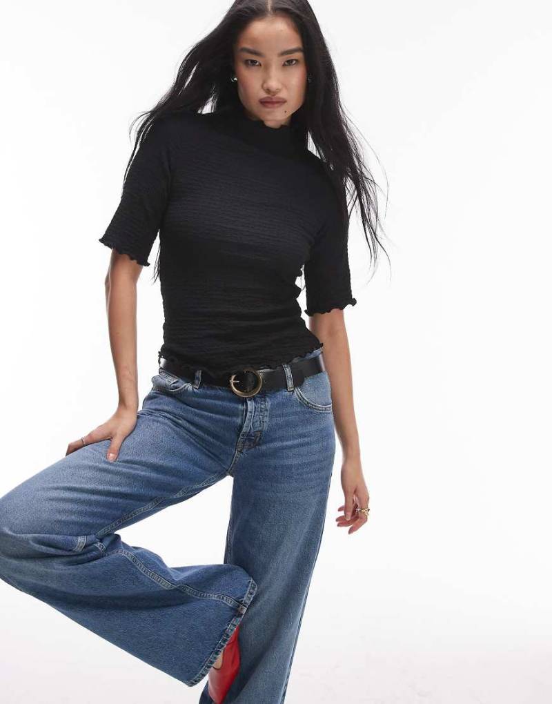 & Other Stories - Hochgeschlossenes Oberteil aus Jersey in Schwarz mit ellbogenlangen Ärmeln und unversäuberten Kanten von Other Stories