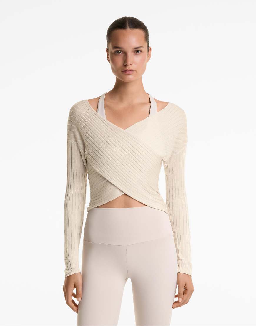 OYSHO - Halbtransparenter Pullover aus Feinstrick in Hellrosa mit überkreuztem Design und Rippenmuster von Oysho
