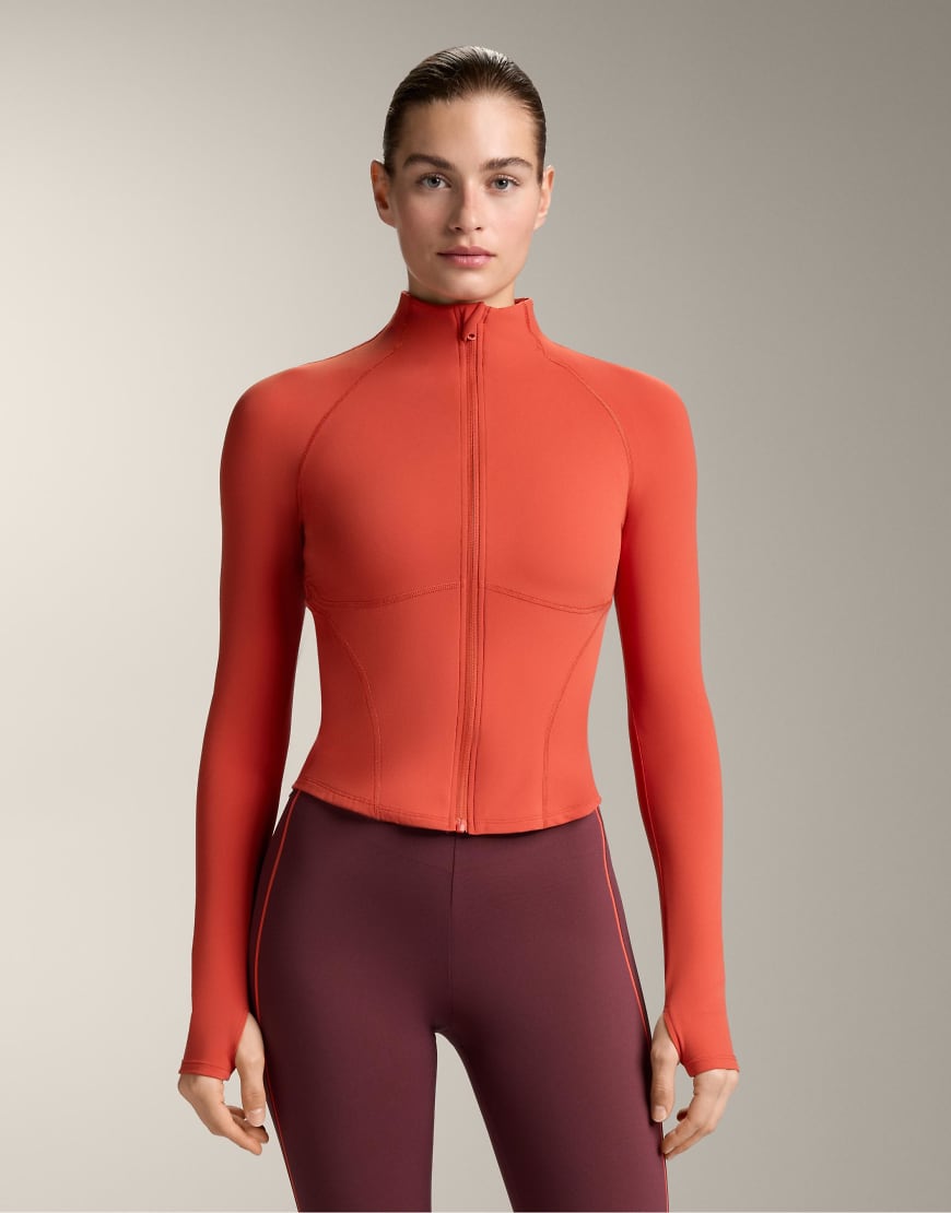 OYSHO - Leichte, warme Jacke in dunklem Orange mit Ziernähten von OYSHO