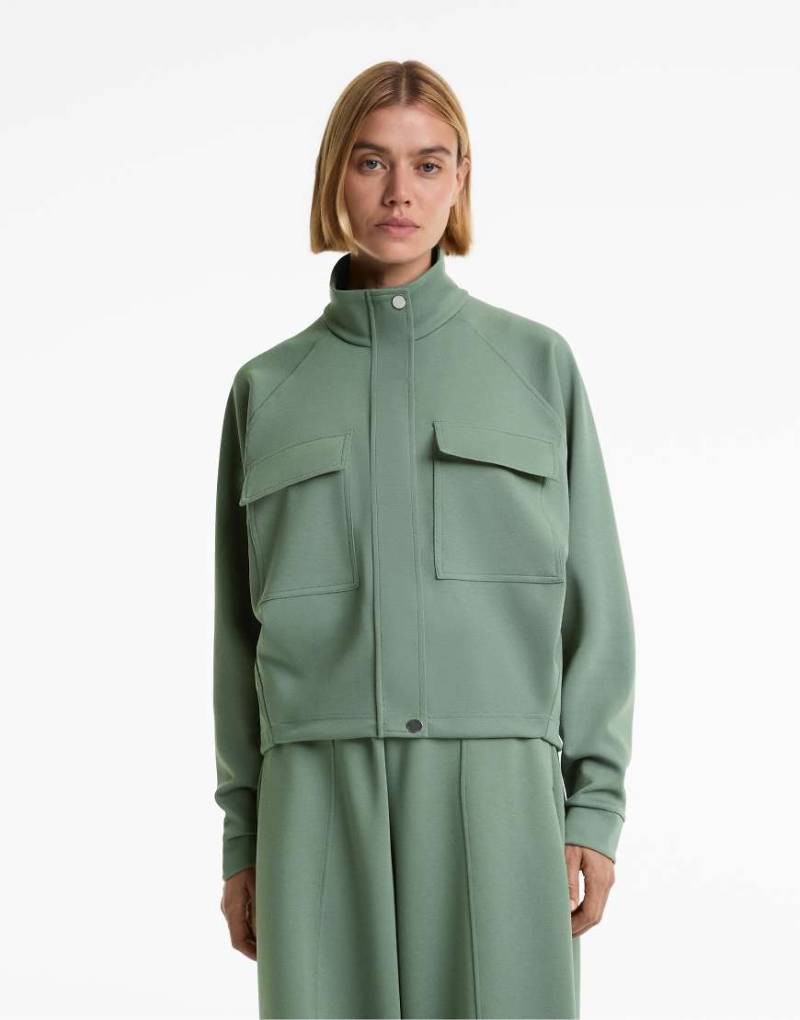 OYSHO - Pikee-Jacke in verwaschenem Grün mit Baumwollanteil und Taschen von Oysho