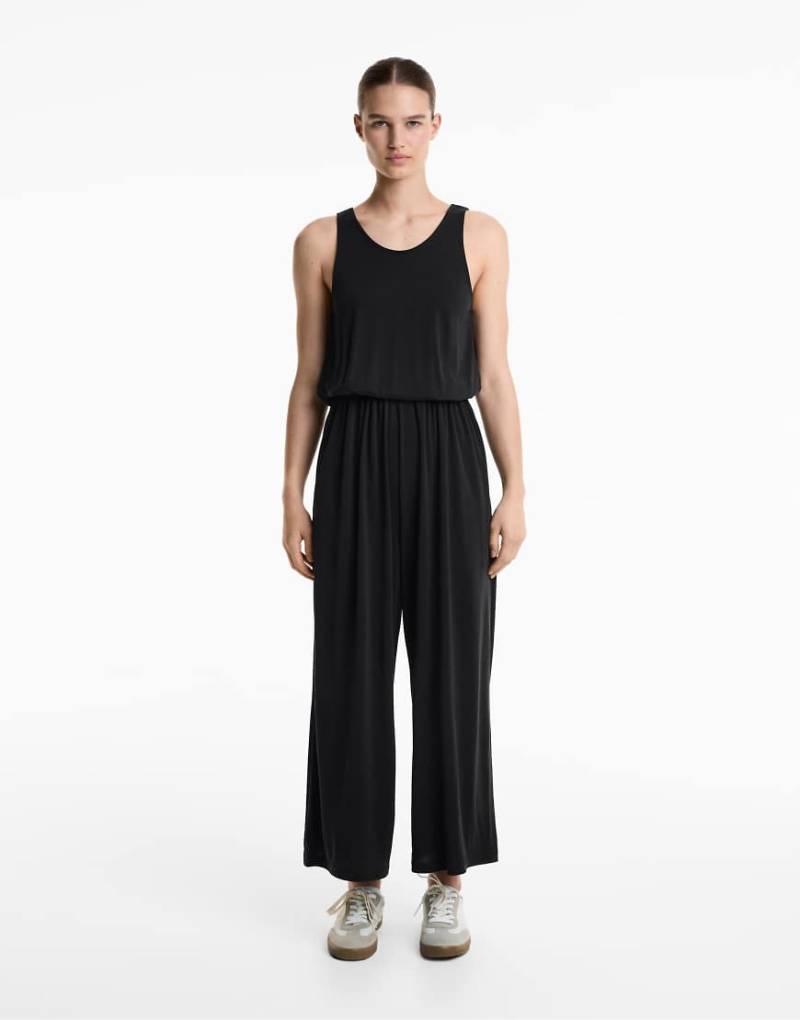 Oysho - Fließender Midi-Jumpsuit aus Modal in Schwarz mit überkreuztem Design am Rücken von Oysho