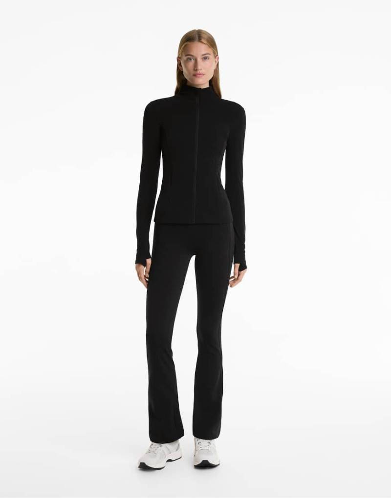 Oysho - Warme Schlaghose in Schwarz mit hohem Bund Oysho - Warme Schlaghose in Schwarz mit hohem Bund von Oysho
