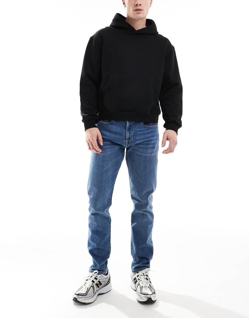 PS Paul Smith - Schmal zulaufende Jeans in mittelblauer Waschung PS Paul Smith - Schmal zulaufende Jeans in mittelblauer Waschung von PS Paul Smith
