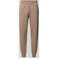 PUMA PERFORMANCE Sweatpants mit Logo-Stitching in Taupe, Größe XXL von PUMA PERFORMANCE
