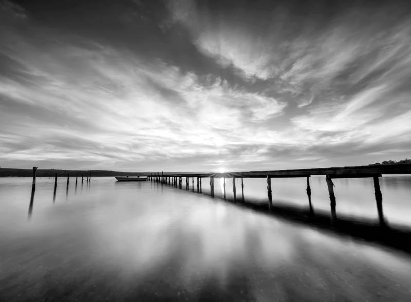 Papermoon Fototapete "Steg im Wasser Schwarz & Weiß" von Papermoon