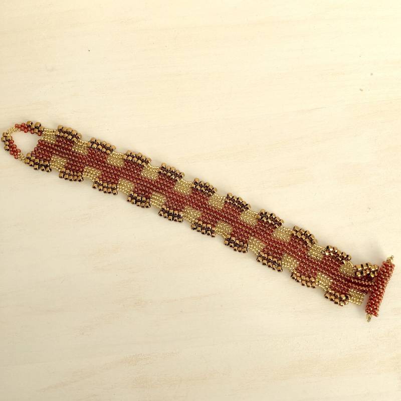 Rot Und Bronze Herringbone Stich Perlen Armband Rot Und Bronze Herringbone Stich Perlen Armband von PaulineMarieDesigns
