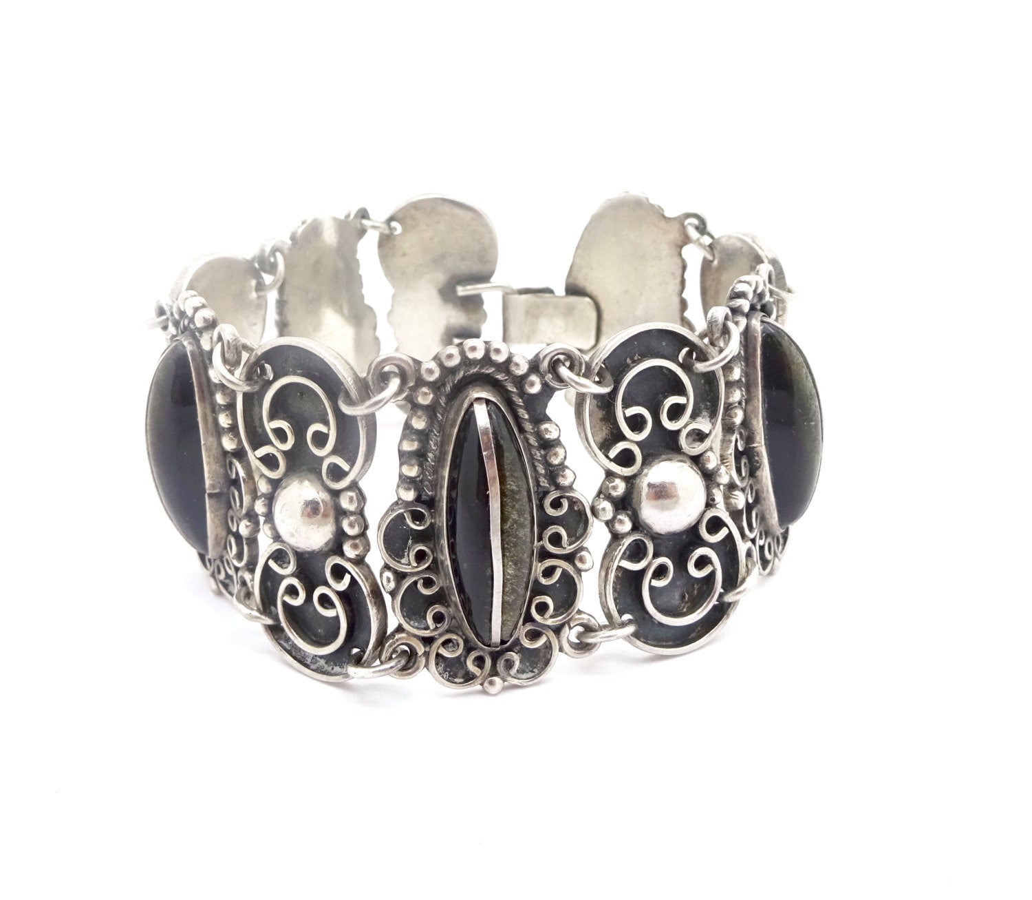 Vintage Taxco Sterling Armband Damaso Gallegos Mexiko Sterling Silber Labradorit Onyx Panel Link Vintage Taxco Sterling Armband Damaso Gallegos Mexiko Sterling Silber Labradorit Onyx Panel Link von Pizzapusshorse