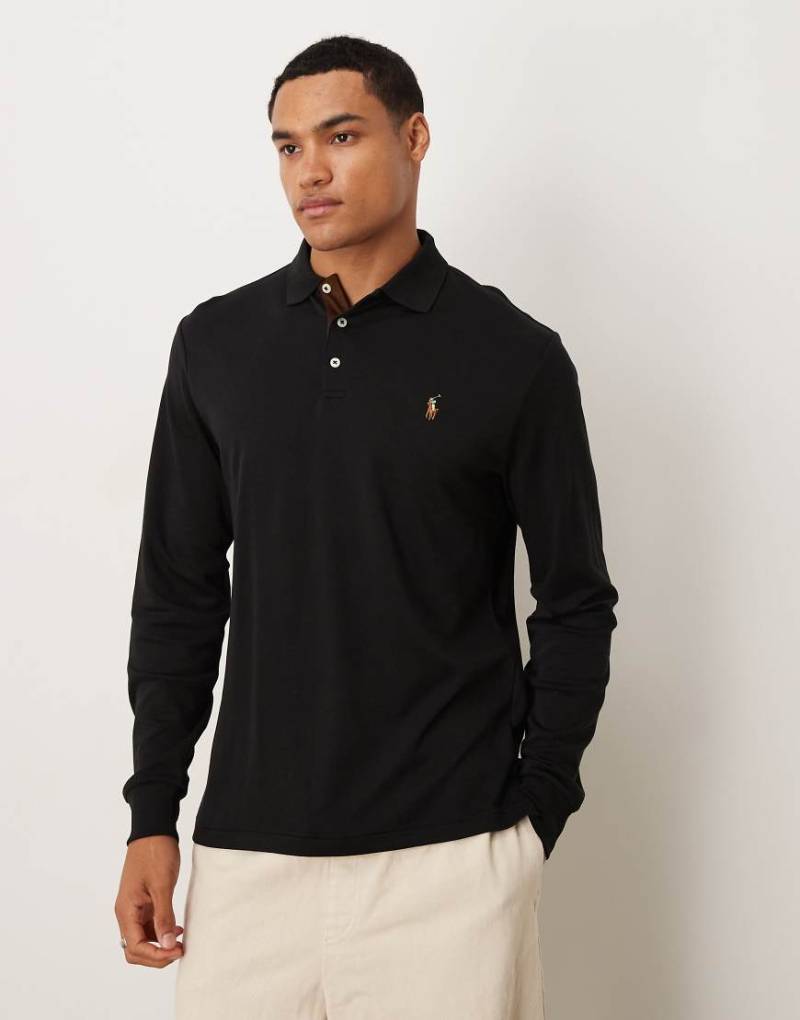 Polo Ralph Lauren - Figurbetontes, langärmliges Polohemd aus Pima-Baumwolle in Schwarz mit Markenlogo Polo Ralph Lauren - Figurbetontes, langärmliges Polohemd aus Pima-Baumwolle in Schwarz mit Markenlogo von Polo Ralph Lauren