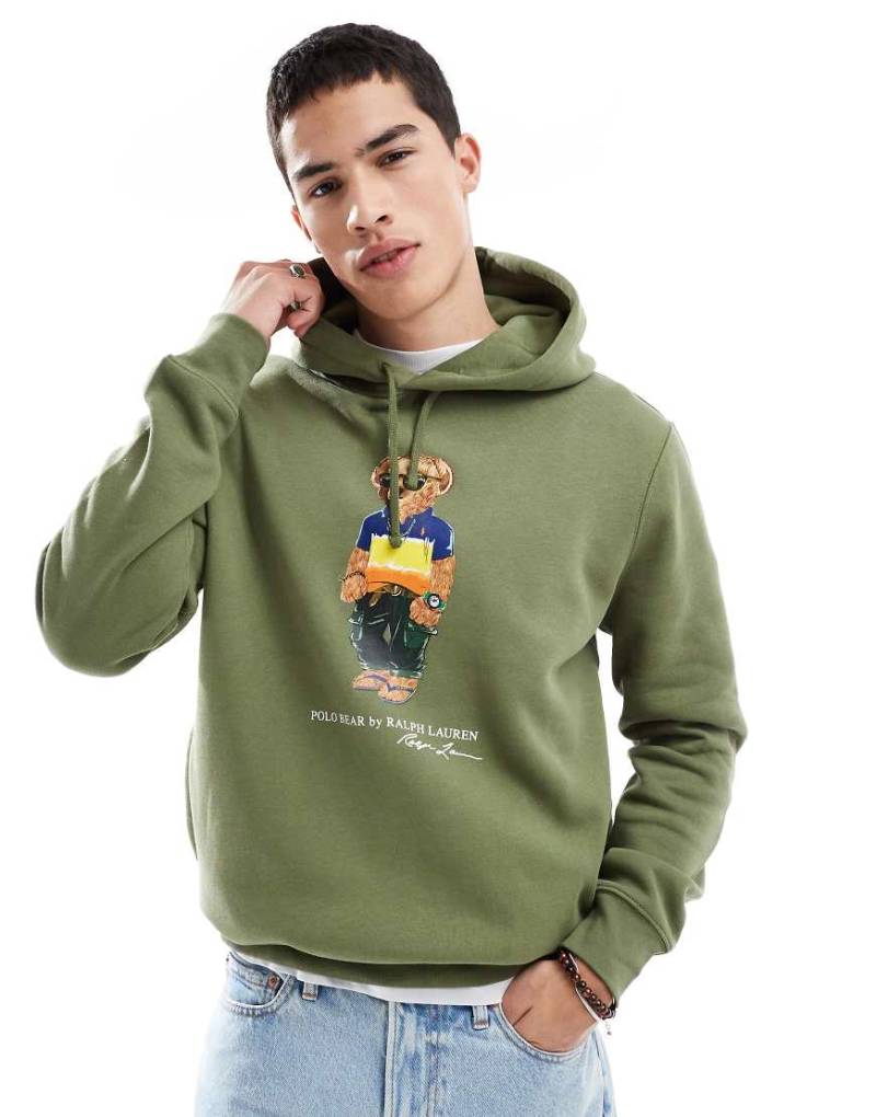 Polo Ralph Lauren - Fleece-Kapuzenpullover in Grün mit Strandbär-Print-Weiß von Polo Ralph Lauren