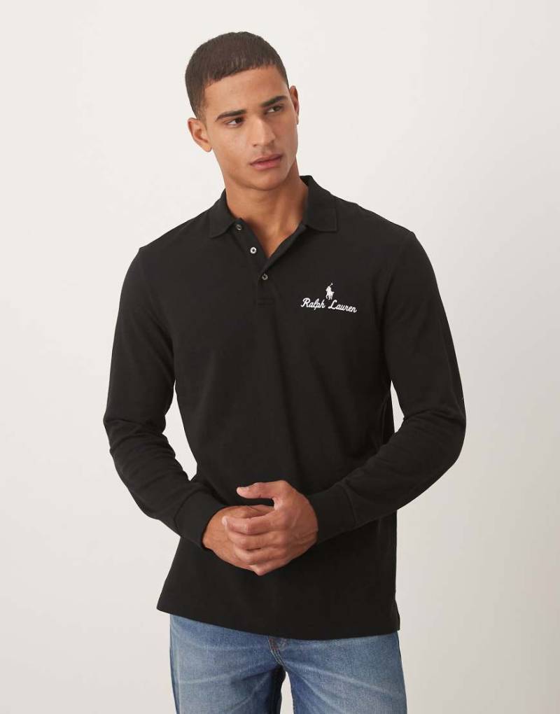 Polo Ralph Lauren - Langärmliges Pikee-Polohemd in Schwarz mit klassischem Oversize-Schnitt und Markenlogo-Schriftzug Polo Ralph Lauren - Langärmliges Pikee-Polohemd in Schwarz mit klassischem Oversize-Schnitt und Markenlogo-Schriftzug von Polo Ralph Lauren