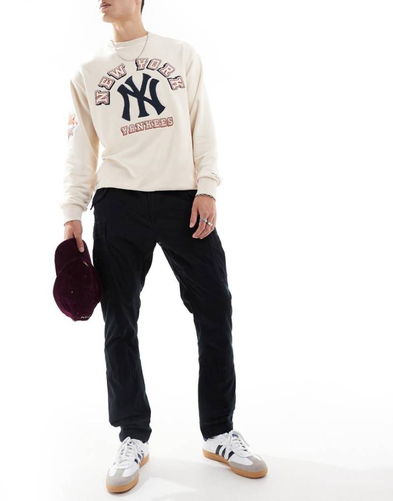 Polo Ralph Lauren - Schmal geschnittene Cargohose aus genopptem Canvas in Schwarz Polo Ralph Lauren - Schmal geschnittene Cargohose aus genopptem Canvas in Schwarz von Polo Ralph Lauren