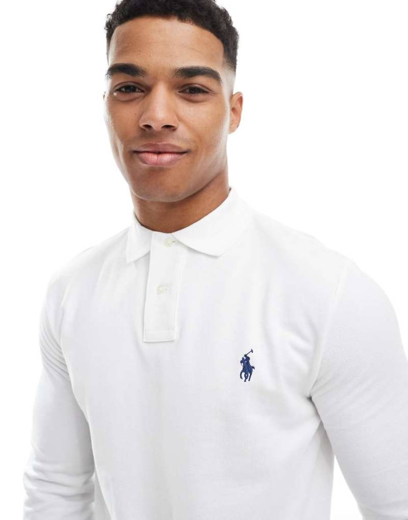 Polo Ralph Lauren - Weißes Polohemd in Custom Slim Fit mit langen Ärmeln Polo Ralph Lauren - Weißes Polohemd in Custom Slim Fit mit langen Ärmeln von Polo Ralph Lauren
