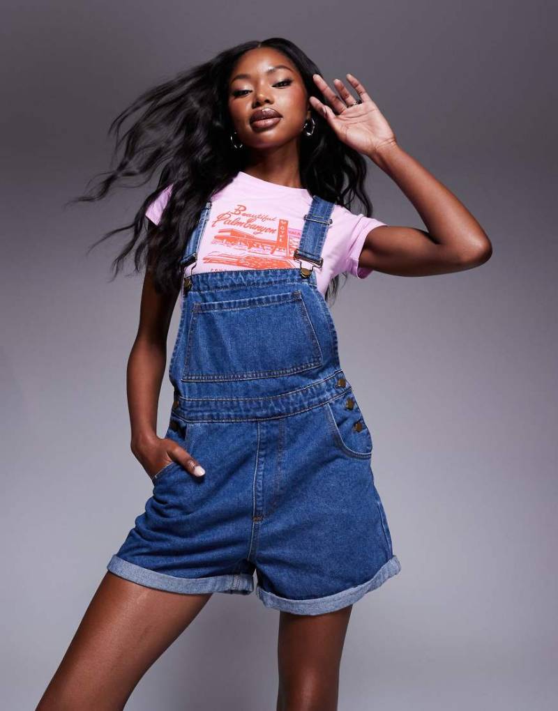 Princess Polly - Jeans-Latzhose in Blau mit Tasche vorne von Princess Polly