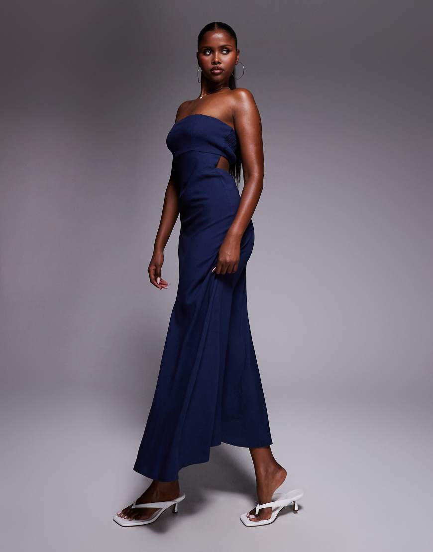 Princess Polly - Yahir - Trägerloses Maxikleid in Marineblau mit Leinenanteil, gesmokter Rückseite und Zierausschnitt Princess Polly - Yahir - Trägerloses Maxikleid in Marineblau mit Leinenanteil, gesmokter Rückseite und Zierausschnitt von Princess Polly