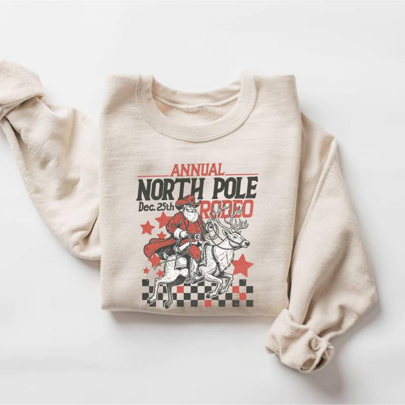 Cowboy Weihnachtsmann Sweatshirt, Retro Western Weihnachten Pullover, Geschenk, Wilder Westen Shirt, Nordpol Rodeo Tshirt, T-Shirt von PrintBoutique4U