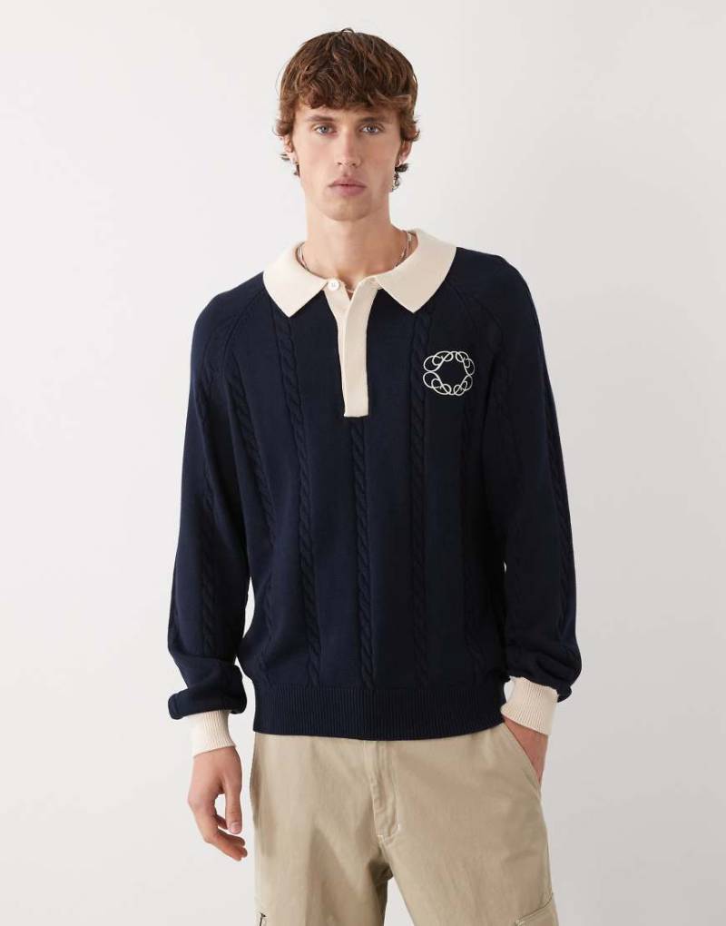 Prohibited - Langärmliges, gestricktes Oversize-Polohemd in Marineblau mit Emblem-Logo von Prohibited