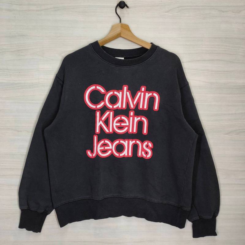 Vtg Calvin Clein Jeans Sweatshirt Große Vintage Ck Pullover Rundhalsausschnitt Schwarz Größe L von PsVintageStore