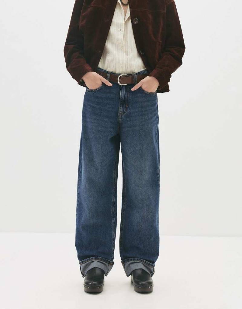 Pull & Bear - Baggy-Jeans in Dunkelblau mit Krempelsaum Pull & Bear - Baggy-Jeans in Dunkelblau mit Krempelsaum von Pull & Bear