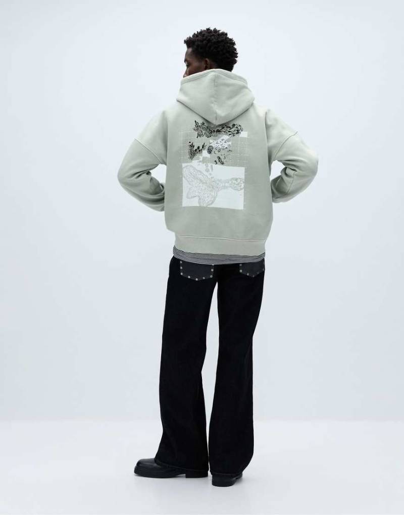 Pull & Bear - Oversize-Kapuzenpullover in Blaugrün mit Grafikprint von Pull & Bear