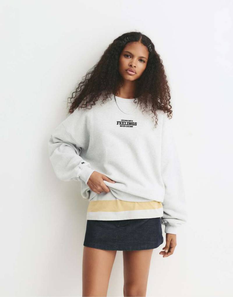 Pull & Bear - Sweatshirt in meliertem Grau mit Sonnenblume-Grafikmotiv von Pull & Bear